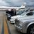A convoy of 16 Mercedes limousines were led by our Rolls Royce Phantom to transport members of the Royal Family of the United Arab Emirates into Baltimore escorted by motor cycle police. Pictured are the chauffeurs and security personnel watching the private 747 arrive.